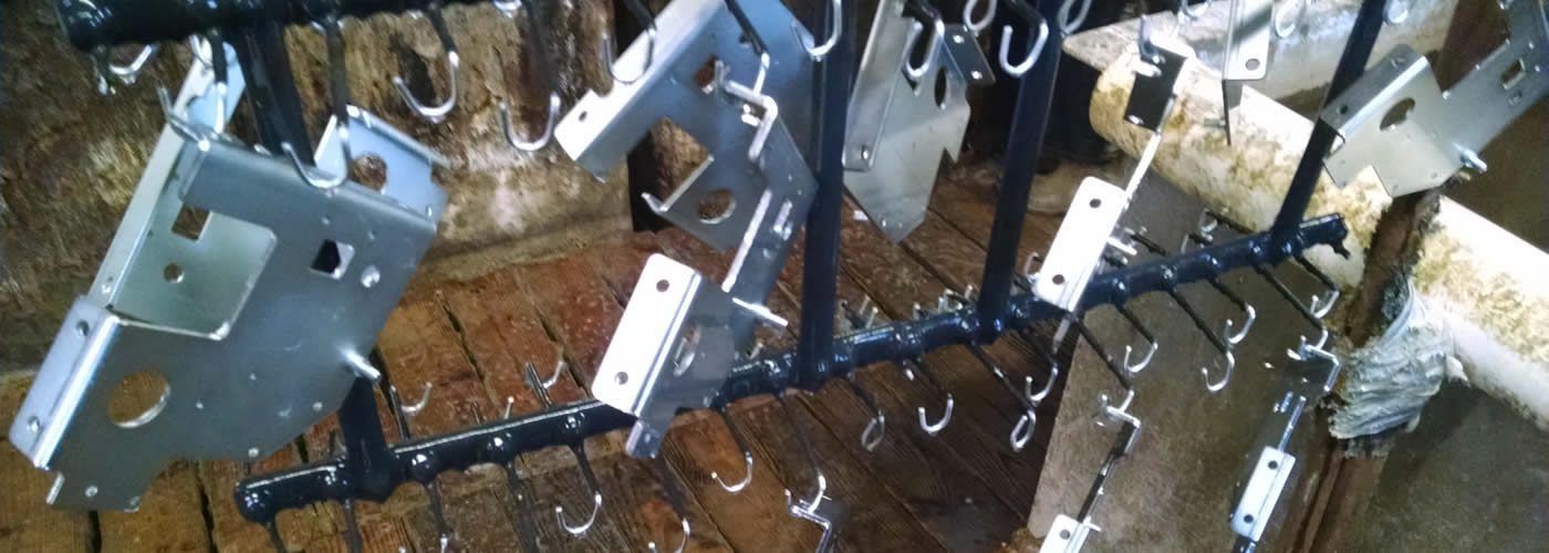 Parts on a plating rack at Parker Metal Finishing